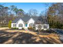 Charming single-story home with manicured lawn, blue door and dark shutters at 25 Sherman Nw Ln, Cartersville, GA 30121