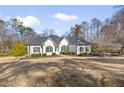Charming single-story home with manicured lawn, blue door and dark shutters at 25 Sherman Nw Ln, Cartersville, GA 30121