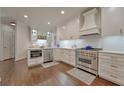 Well-equipped kitchen features stainless steel appliances, custom cabinetry and ample counter space at 155 Oakpark Ct, Mcdonough, GA 30253