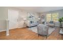 Comfortable living room boasts hardwood floors, natural light, stylish furniture and modern decor at 2201 Fairington Village Dr, Lithonia, GA 30038
