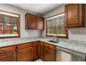 Kitchen featuring granite countertops, stainless steel appliances, and wood cabinets at 461 Deckner Sw Ave, Atlanta, GA 30310