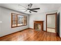 Bright living room with hardwood floors, fireplace, and large window at 461 Deckner Sw Ave, Atlanta, GA 30310