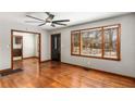 Bright living room features hardwood floors, a ceiling fan and large windows at 461 Deckner Sw Ave, Atlanta, GA 30310