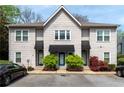 Attractive townhouse exterior with blue door awnings, manicured landscaping, and visible parking at 808 Dixie Ne Ave, Atlanta, GA 30307