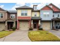 Colorful townhome exteriors, each with a private attached garage and well-kept landscaping at 4116 Mars Bay # 27, Acworth, GA 30101