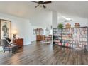 Spacious living room with hardwood floors, a ceiling fan, and an open floor plan at 245 Dennis Dr, Alpharetta, GA 30009