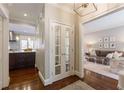 Hallway view into a living room and kitchen with hardwood floors at 78 Paces West Nw Cir, Atlanta, GA 30327