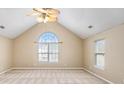 Vaulted ceiling and large windows fill this main bedroom with plenty of natural light at 5027 Estonian Dr, Fairburn, GA 30213