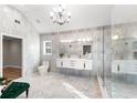 Modern bathroom with double vanity, glass shower, and stylish tile work at 8160 Stone Hill Rd, Cumming, GA 30028