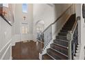 Grand foyer with hardwood floors, high ceilings, staircase, and arched entryway at 1617 Matt Springs Dr, Lawrenceville, GA 30045