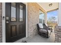 Inviting front porch with wicker chairs, perfect for relaxing and enjoying the outdoors at 1617 Matt Springs Dr, Lawrenceville, GA 30045