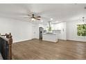 Bright, open-concept living area with hardwood floors and modern finishes throughout at 5539 Andrew Sw Dr, Mableton, GA 30126