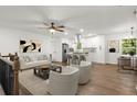 Bright, open-concept living area with hardwood floors and modern finishes throughout at 5539 Andrew Sw Dr, Mableton, GA 30126