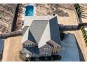 Aerial view of a home with a pool, spacious backyard, and well-maintained landscaping at 8340 Nolandwood Ln, Villa Rica, GA 30180
