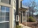 Close up of condo showing a red front door, lattice fence, and outside storage area at 1401 Riverview Se Dr # 1401, Marietta, GA 30067