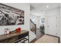 Charming foyer showcasing wood floors, decorative furnishings, and a staircase at 4414 Declan Dr, Kennesaw, GA 30144