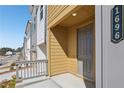 Welcoming front entrance with a covered porch, offering a glimpse of the modern exterior at 1696 Gunnin Nw Trce # 244, Atlanta, GA 30318