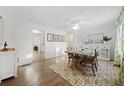 Elegant dining room with hardwood floors, a modern rug, and ample natural light at 2796 Georgian W Dr, Brookhaven, GA 30341