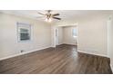 Bright living room with modern flooring and natural light, seamlessly connected to other spaces at 1113 Grace Sw St, Mableton, GA 30126