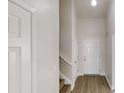 Inviting foyer with hardwood floors and a staircase at 2357 Wellborn Hills Pl, Lithonia, GA 30058
