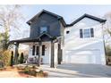 Picture of a two-story home with a covered porch and front yard landscaping at 496 Federal Se Ter, Atlanta, GA 30315