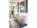 Inviting front porch with stylish outdoor furniture, a rug, and decorative accents at 496 Federal Se Ter, Atlanta, GA 30315