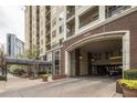 The exterior shows a covered entrance to the building with an access point for covered parking at 1101 Juniper St # 61, Atlanta, GA 30309