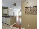 A kitchen with neutral cabinets and hardware that seamlessly flows into the living area at 1101 Juniper St # 61, Atlanta, GA 30309