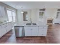 Bright, open kitchen featuring a large center island, stainless steel appliances, and granite countertops at 3780 Baxley Pine Trl, Suwanee, GA 30024