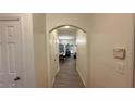 Bright hallway features an arched entryway and clean, neutral tones throughout the space at 1530 Viero Dr, Lawrenceville, GA 30044