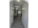 Inviting hallway with modern gray flooring and chandelier view at 1530 Viero Dr, Lawrenceville, GA 30044