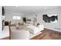 Inviting living room features hardwood floors, a fireplace, a comfortable white couch, and neutral decor at 2288 Street Deville Ne, Atlanta, GA 30345