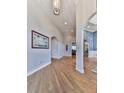 Bright foyer featuring hardwood floors, recessed lighting, arched doorways, and detailed trim work at 329 Lakebridge Xing, Canton, GA 30114