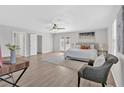 Spacious bedroom featuring a ceiling fan, double doors, and a seating area at 345 Wellington Sw St, Atlanta, GA 30310