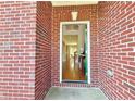 Entryway with hardwood floors and a glimpse into the living spaces at 5819 Rue Chase Way, Tucker, GA 30084