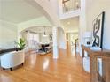 Spacious living area with hardwood floors, neutral decor, and dining space at 5819 Rue Chase Way, Tucker, GA 30084