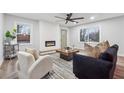 Comfortable living room with ample natural light, a stylish fireplace and views of the outdoors at 1849 S Columbia Place, Decatur, GA 30032