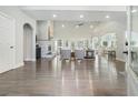 Spacious living room with hardwood floors, high ceilings, large windows, and an open layout perfect for entertaining at 5690 Rutland Trce, Lithonia, GA 30058