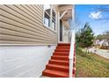 A close up of the front entrance featuring red stairs and a covered porch at 2370 Mcafee Rd, Decatur, GA 30032
