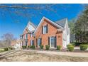 Lovely brick home with black shutters and trimmed bushes enhancing its curb appeal at 4780 Woodruff Trce, Cumming, GA 30028
