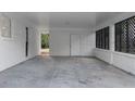 Spacious carport with white brick walls and covered parking at 1066 Cleavemark Dr, Clarkston, GA 30021