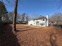 Large, fenced backyard perfect for outdoor activities, featuring a traditional exterior at 2716 Wynford Sw Ave, Marietta, GA 30064