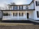 Inviting front porch with white railings and black shutters, enhancing curb appeal at 2716 Wynford Sw Ave, Marietta, GA 30064
