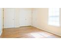Spacious bedroom showcasing gleaming hardwood floors and ample natural light at 5352 Beaver Br, Norcross, GA 30071