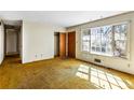 Bedroom featuring a large window, closet, and outdated yellow carpeting at 3160 Ann Se Rd, Smyrna, GA 30080