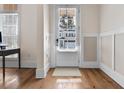 Stylish entryway with hardwood floors, neutral walls, and a bright white door with window at 4535 Atley Woods Se Dr, Atlanta, GA 30339