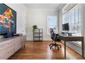 Modern home office with hardwood floors, a large window, and contemporary furnishings at 4535 Atley Woods Se Dr, Atlanta, GA 30339