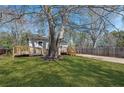 Cozy home featuring a ramp and porch, set in a large, grassy front yard at 5153 Westbrook Pl, Union City, GA 30291