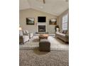 A welcoming living room with a fireplace, complemented by comfortable seating and stylish decor at 5550 Mccrossin Cir, Stonecrest, GA 30038