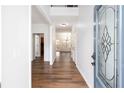 Bright foyer showcasing hardwood floors, high ceilings, and an inviting entryway at 264 Ascott Ln, Woodstock, GA 30189